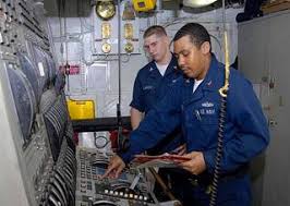Engineman 1st Class Daniel Citizen from Lafayette, La., front, and  Engineman 2nd Class David Larson, from Bigelow, Ark., prepare the main  machinery room number 2 operating station for an operational test. -
