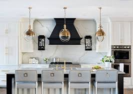 The Kitchen Cabinets Are Painted In Benjamin Moore Swiss Coffee And The Black Hood Paint Color Is Benjam Kitchen Design Interior Design Kitchen Kitchen Remodel