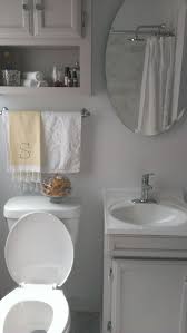 The lively wallpaper pattern from bradbury & bradbury — atomic doodle in taupe — gives this pink and gray bathroom a fun feel. Small Bathroom Chicago Sharkey Gray Bathroom Organization Decor Small Bathroom Bathroom Inspiration