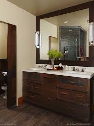 Full size of bathroom small maste modern small bathroom tile ideas 028 the tile behind the mirrors is visually appealing, and i like the way the dark cabinets pop with the matching dark browns Tile Floors Design Ideas Pictures Remodel And Decor Wood Tile Bathroom Traditional Bathroom Bathroom Design