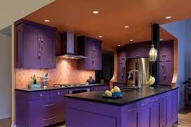 Dark oak veneer kitchen with glass backsplash, dark cabinets, funky lighting and high gloss lift up wall units that is simply stunning. Best Colors To Use For Kitchen Cabinets Best Online Cabinets