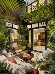 Patio With Indoor Garden With Sofa And Round Coffe Table Tropical Patio Outdoor Rooms Indoor Gardens