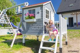 We'll show you the top 10 most popular house styles, including cape cod, country french, colonial, victorian, tudor, craftsman, cottage, mediterranean, ranch, and contemporary. Little Girl Portrait With The Dog At The Beautiful Garden House Kaufen Sie Dieses Foto Und Finden Sie Ahnliche Bilder Auf Adobe Stock Adobe Stock