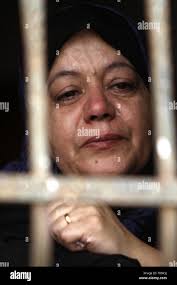 Relative mourns during funeral palestinian hi-res stock photography and  images