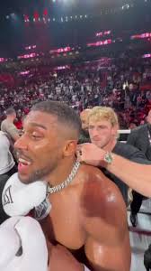 Anthony Joshua's security forced to confront Logan Paul as he tries to  snatch boxer's £370k chain after Jake Paul fight