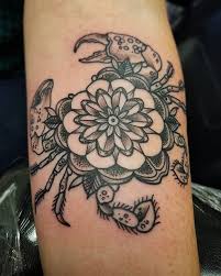 If you're looking for something simple to get inked on your skin, look to your cancer horoscope for a great place to start. The World Famous Emerald Tattoo And Piercing In Business Since 2007 Crab Tattoo Cancer Zodiac Tattoo Cancer Sign Tattoos
