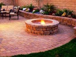 Complete the paver layering with a third ring. Retaining Walls And Fire Pits Transitional Landscaping Stones And Pavers Fire Pit Patio Brick Patios Diy Patio Pavers