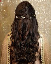 Why Flowers In Open Hair Are The Best Way To Add A Touch Of Glam In Your Mehendi Hairstyle Hair Styles Long Hair Styles Engagement Hairstyles