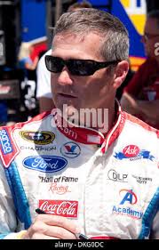 NASCAR driver Bobby Labonte stands by his car