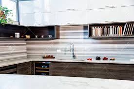 brown wood kitchen cabinets with full