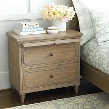 Founded on four splayed legs, this piece is crafted from solid sheesham wood in a natural finish that highlights its knots and grains. Isabella Natural Large Nightstand