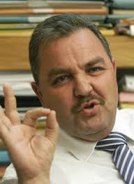 Partner in the Speaker's law firm to defend Police Minister's driver