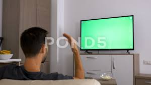 Man Watching A Big Green Mock Up Screen Tv Stock Footage Ad Big Green Man Watching In 2020 Mocking Big Green Greenscreen
