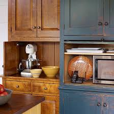 Side By Side Appliance Garages In Retrofitted Cabinetry Give This Kitchen Function Without Visual Appliance Garage Kitchen Appliance Storage Appliances Storage