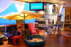 Beach Umbrellas Lounge Chairs And A Sandbox Added To The Beach Themed Decor At The Cn Tower Beach Theme Decor Beach Themed Party Beach Themes