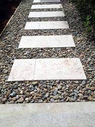 Travertine Stepping Stones Beautiful Modern Looking Travertine That Combined With Pebbles Will Enhance Your Pool Landscaping Pebble Landscaping Garden Pavers