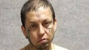 Man charged with murder, assaulting an officer after other man's body found  in truck