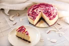 Whizz the biscuits, butter, coconut and lime zest together in a food processor until the mixture has the texture of damp sand, then pour into the prepared tin. Coconut White Chocolate Cheesecake With A Strawberry Swirl And Brownie Bottom
