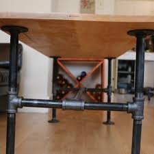 The table frame fittings and pipe were treated with toilet bowl cleaner in order to age the metal and give it a more distressed look. Diy Modern Coffee Table With Black Pipes How To