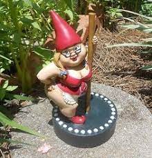 He has a red cap, thick black belt around his shirt and black wellies. Gnomes