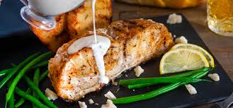 Combine oil, lemon juice, thyme or oregano, garlic, and pepper in a large shallow bowl. Grilled Chilean Sea Bass With Grilled Bread And Cider Cream Sauce Recipe