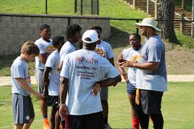 Evans conducts Character Football Camp