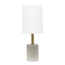 The unique raised texture and design of the base makes for a neutral addition to any style of home decor and the linen drum shade tops it off nicely. Elegant Designs Cement Table Lamp With Antique Brass Detail White All The Rages