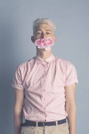 Boy With Flowers In His Mouth Creative Fashion Photography Creative Fashion Flowers For Men