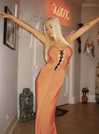 Christina Aguilera celebrates her favorite time of the year with an  orange and black sexy dress