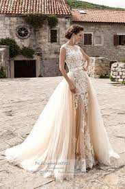 Elegant lace mermaid style wedding dress with v neckline and open back. 2017 Champagne Lace Beach Wedding Dresses Overskirt Detachable Train Applique Sheer Sheer Skirt Mermaid We Lace Bridal Gown Wedding Dresses Sheer Wedding Dress
