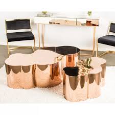 The cross leg base and the drawer pulls. Tanksley Solid Coffee Table Whimsical Coffee Table Rose Gold Coffee Table Gold Coffee Table