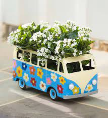 A volkswagen type 2, or vw bus. Blue Metal Flower Power Bus Planter Plowhearth
