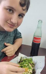 Is the Mexican taco stand open across from the liquor store?