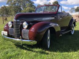 Image result for Trojan Maroon 1939 Oldsmobile