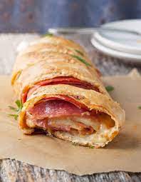 A Fast And Easy Stromboli Is The Perfect Dinner Less Than 30 Minutes And Your House Will Smell Like Your Favori Stromboli Recipe Easy Stromboli Recipe Recipes