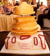 Monochrome striped wedding cake with bright flower detail by wild orchid baking. Unique Traditional Wedding Cakes For Your Nigerian Wedding