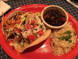 Chopped romaine lettuce topped with grape tomato, roasted corn, black beans, shredded monterrey jack and. Fish Tacos Picture Of Uncle Julio S Rio Grande Cafe Fairfax Tripadvisor