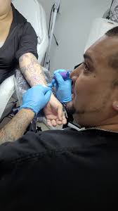 Ferny Martinez in the middle of a tattoo session. Stop by and book today.