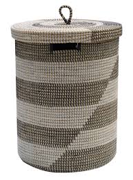 The black & white basket by cosmic is a luxurious bathroom accessory that adds both utility and minimalistic charm to modern bathrooms. Seagrass Baskets With Flat Lid Black White Large