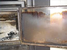 To clean out the ashes, first lift up the fireplace clean out doors and ash dumps are two ways to remove ashes from the fireplace without having to carry them through the house! How To Clean The Glass Door Of A Wood Stove Hunker Glass Fireplace Fireplace Glass Doors Clean Fireplace