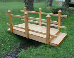 Like a gazebo or an arbor trellis, a footbridge is one of those garden structures that helps transform a plain backyard into a charming and livable outdoor space. Garden Bridge Backyard Bridges Garden Bridge Woodland Garden
