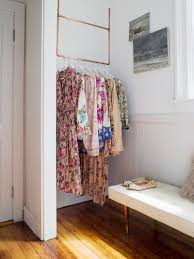 How To Diy A Ceiling Mounted Clothes Rack In 3 Easy Steps In 2020 Clothes Storage Without A Closet Hanging Clothes Racks Diy Clothes Hanger Rack
