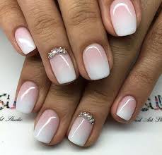 One of the accent nails has gold embellishments and gems, while the other nail has beautiful ombre. 110 Awesome Gel Nails That Will Have You Running To The Salon