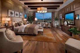 Rustic Beams Wall Moldings And A Distinctive Light Fixture Define This Owner S Suite New Homes By Rosewood Homes In Rosewood A Home House Design House Styles