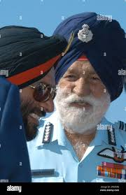 Indian Army Chief Gen. Joginder Jaswant Singh, left, speaks with Marshall  of the Air Force Arjan Singh at the inaugural ceremony of Aero India 2005  at the Air Force Station in Yelahanka,