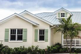 The screen house features moving wooden louvers around the exterior of the upper level. Exterior Shutters By Louver Shop