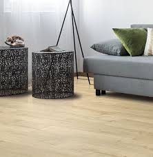 Pergo gets the slight edge due to them being the brand that made this standard possible. Pergo Outlast Vienna Oak Brings A European Influence To Your Office With This Stylish Beige Oak The Light Pore Fill G Pergo Outlast Sophisticated Decor Pergo