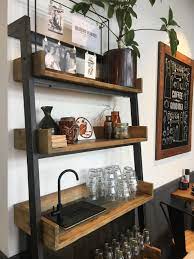 Many entrepreneurs who start a business for the first time will open a coffee shop, milk tea there are shelves on the wall for placing cups, and there are menus on the shelves. Shelving System For A Cafe Water Station Coffee Shop Decor Cafe Decor Restaurant Interior Design