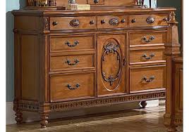 Bush furniture took traditional office furniture from its bland days of gray desks and transformed it into pieces that are stylish while still maintaining their functionality. Vaughan Kathy Ireland Home Southern Heritage Seven Drawer Dresser In Rich Chestnut 327 03