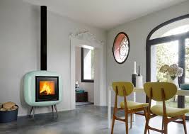 Photo about old black fancy cast iron wood burning stove heater with a vertical stovepipe. 15 Best Stoves Woodburning And Multi Fuel Wood Stove Wood Burning Stove Home Fireplace